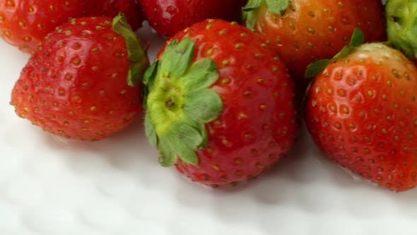Rotation of juicy strawberries. Top view, Rotation 360 degrees, Extreme close up.