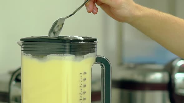Cook Adds Flour To the Mixer Where Eggs Are Beaten alt