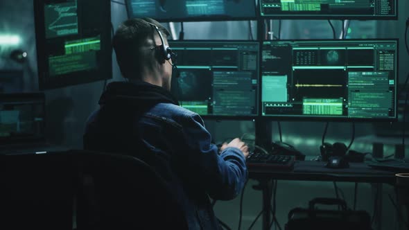 Happy Hacker Discussing Successful Cybercrime alt