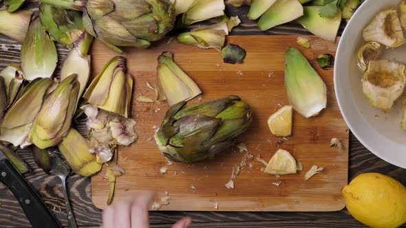 Woman Cleaning Artichokes alt