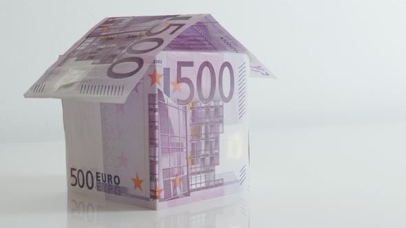 Slow tilt European Union paper money improvised house 4K 21650p 30fps UltraHD footage - Close-up hom alt