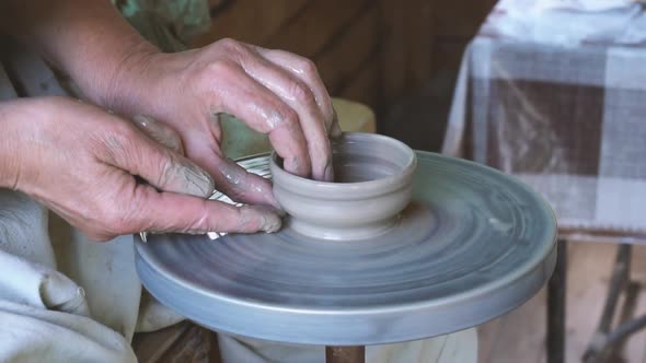 Making Cup on Pottery Wheel in Slow Motion