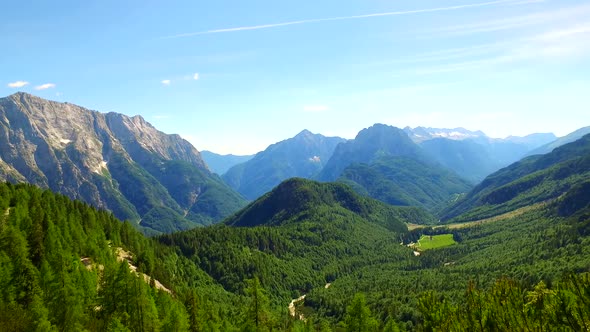 Forests and Valley Under Big Mountains in Summer