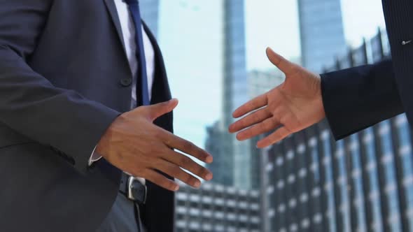 Slow motion of business partners making handshake