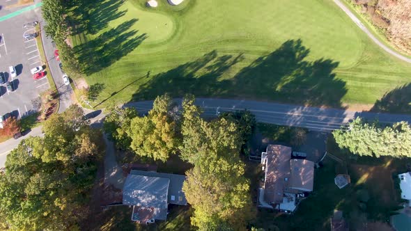 Haverhill town with majestic autumn colors, aerial top down and tilting up view alt