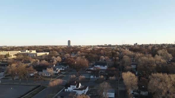 Cityscape view in autumn over residential neighborhood. Blue sky with light clouds.