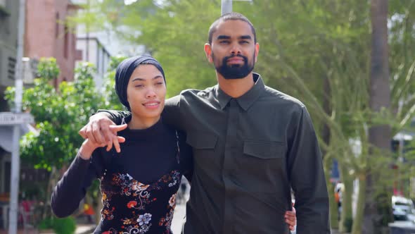 Young couple walking on street 4k alt