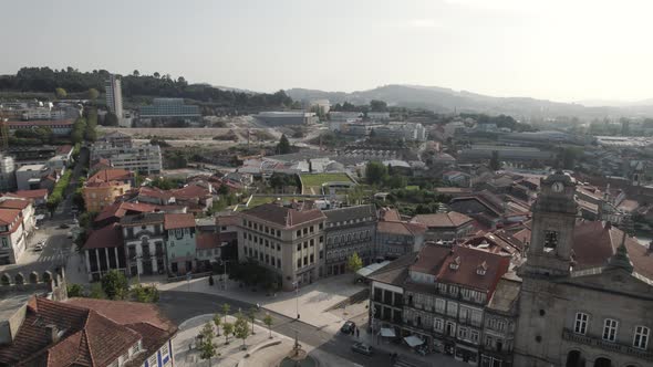 Aerial pan right revealing Beautiful Historic Guimaraes downtown Buildings - Portugal