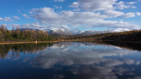 Flying Over the Beautiful Mountain Lake in Altai Mountains, Siberia, Russia. Aerial View