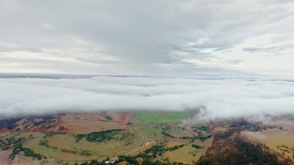 Amazing aerial video of multi-colored fields under the clouds (Wyoming, USA) alt