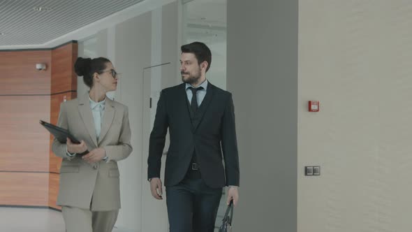 Couple of Lawyers Walking along Office alt