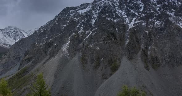 Timelapse of Epic Clouds in Mountain Valley Autumn Time. Wild Endless Nature and Snow Storm Sky Over alt