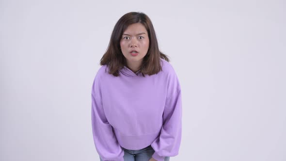 Young Stressed Asian Woman Getting Bad News alt