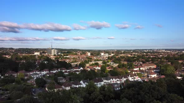 Aerial view of a North London urban town in summer sun. Static drone shot. alt