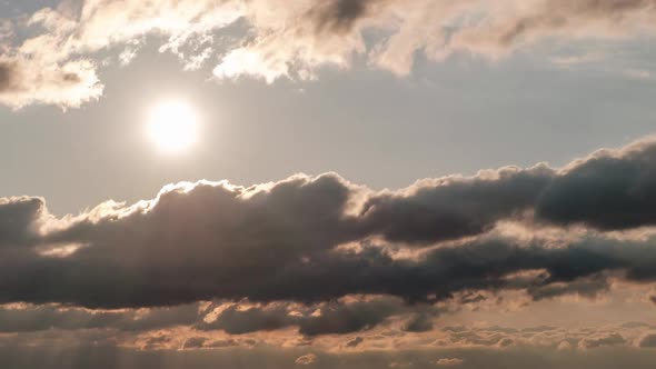 Sunset in the Sky Through Layered Clouds Timelapse alt