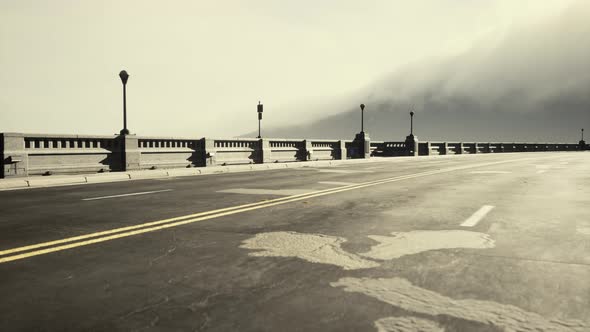 Old Empty Stone Bridge on a Foggy Day alt