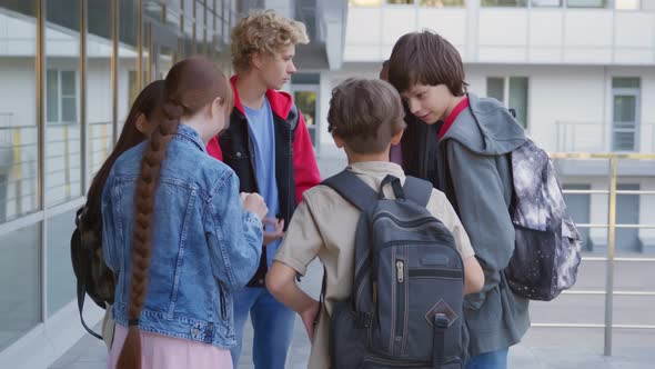 Portrait of Multiethnic Teenage Students Smile at Camera Outside School alt