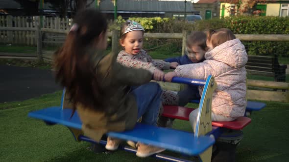 Little Happy Group Children Different Ege Have Fun Spinning on Merrygoround