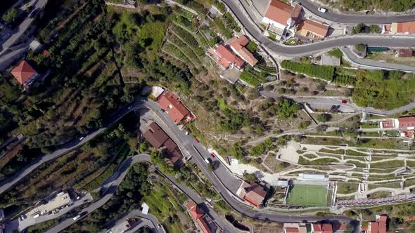 Italian Amalfi coastline terraces with roads in the town of San Michele seen from above, Aerial top alt