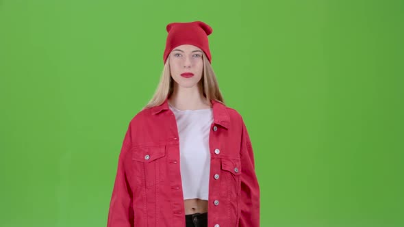 Teen Advertises the Goods and Shows a Finger Down. Green Screen alt