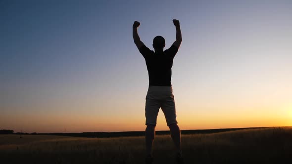 cheerful man jumping in air with hands up