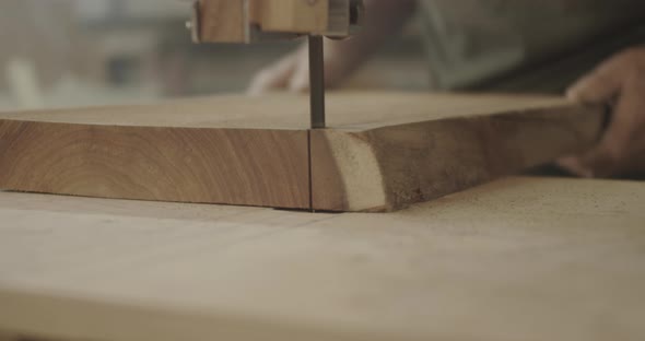 close up of a block of wood being sawed