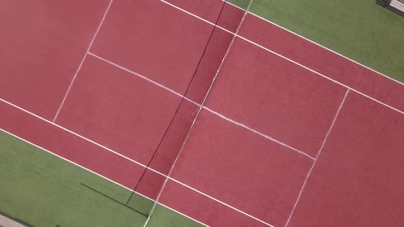 The goal of tennis is to hit the ball over the net into the other player's court.When the other play alt