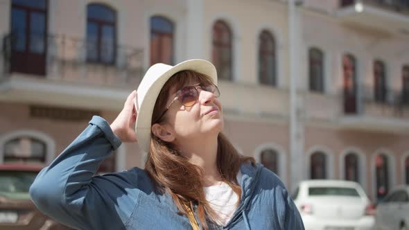 Portrait of Pretty Traveler Woman in Hat Looking Around Have Fun