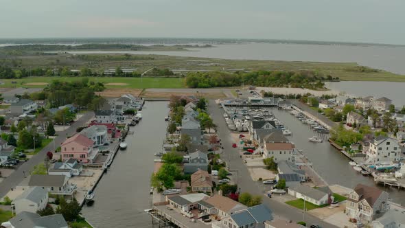 Aerial Drone View of Local Residential Suburb of River in View of Distant Toms River alt