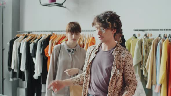 Stylist Helping Multiethnic Girls during Clothes Shopping alt