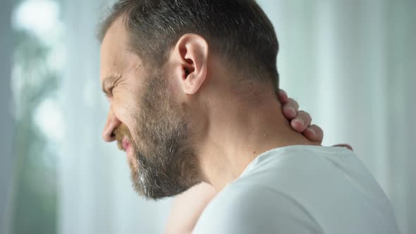 Caucasian Male Massaging Neck, Feeling Discomfort, Spinal Problem, Body Care alt