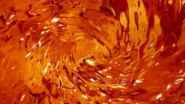 Super Slow Motion Shot of Golden Liquid Vortex at 1000 Fps alt