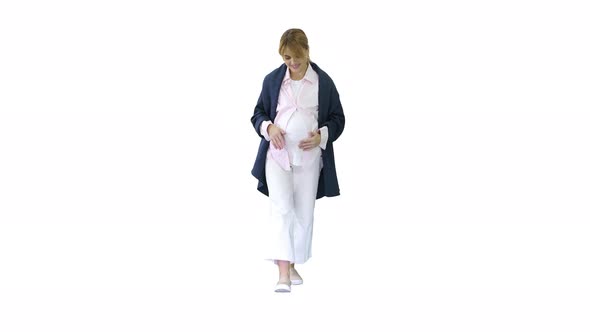 Happy and Proud Pregnant Woman Looking at Her Belly While Walking on White Background