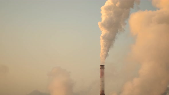 The Smog Spreads Into the Atmosphere From a Large Factory Pipe That Extends Into the Sky alt