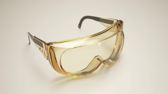 A pair of safety goggles on a white desk. Scientific eyes protection equipment.