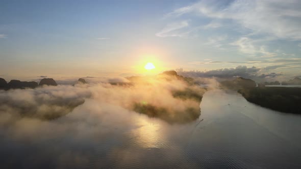 View of sunset or sunrise. Over river and misty cloud in river. Mountain and sky sunset background alt