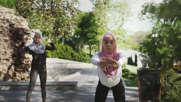 Two Muslim Models in Sport Clothes and Colorful Hijabs alt