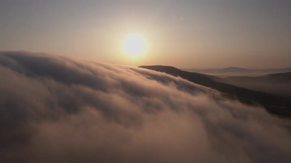 Early morning clouds drift over the mountains in Co Kerry Ireland as the sun shines during the summe alt