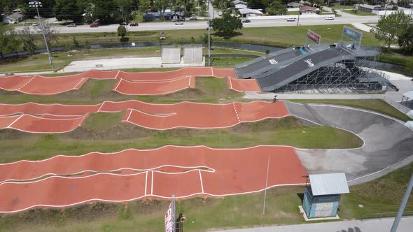 side view of a BMX pump track via drone alt