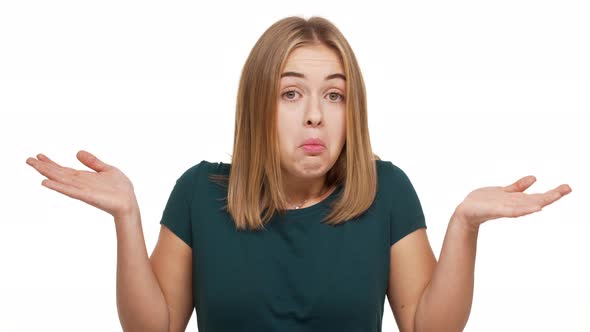 Horizontal Portrait of Longhaired Woman Gesturing with Both Hands Meaning Oops Sorry with Facial alt