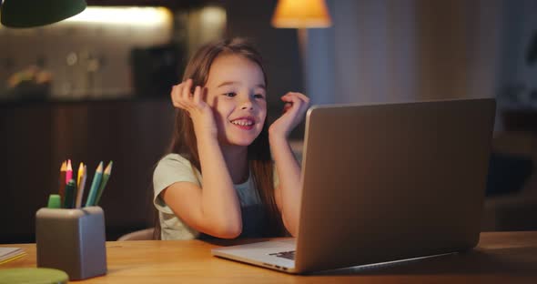 Happy Smiling Preteen Student Girl with Laptop Having Video Call at Home alt