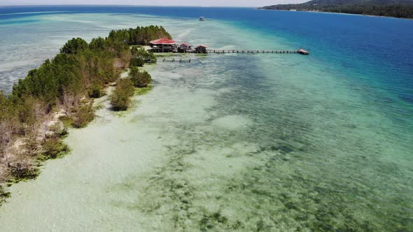 Perishing Island With Crystal Clear Ocean Water Drone Footage