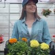 Happy Industrial Greenhouse Worker Carry Boxes Full of Flowers. Smiling and Happy Woman with Flowers - VideoHive Item for Sale