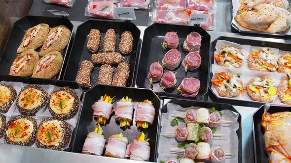 Appetizing Meat Products Are on Display in Special Containers. Meat Products for Sale in a alt