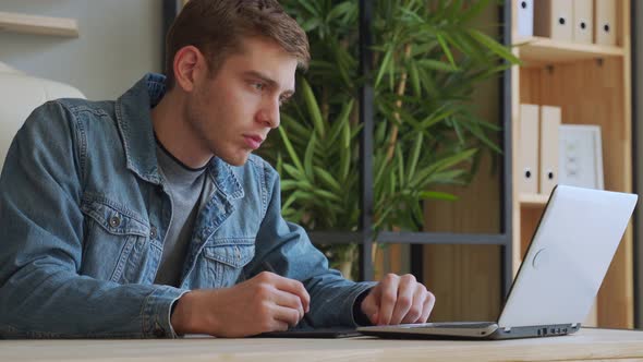 Man Hands Drawing on Graphic Tablet with Stylus. Designer or Digital Artist at Work alt