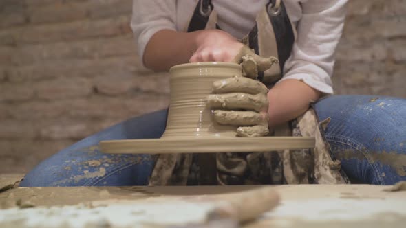 Female Potter Making a Pot