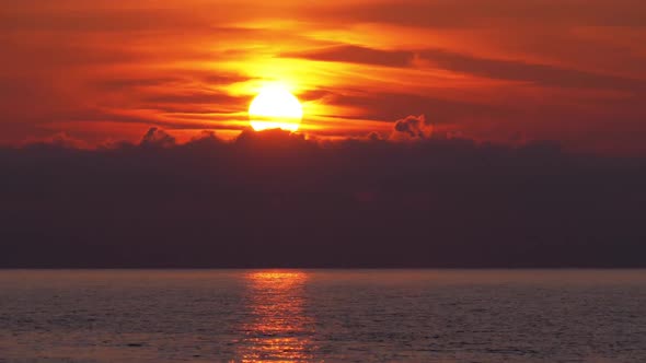 Sunset in the Clouds Over the Sea, Orange Path Sunset in the Sea alt