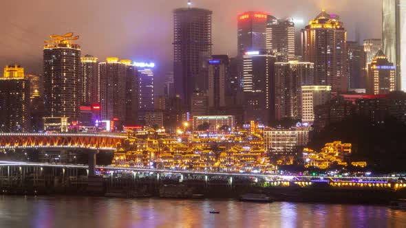 Chongqing/CHINA - JULY 28 2019: Chongqing Hongyadong Night Cityscape China Timelapse Pan Up alt