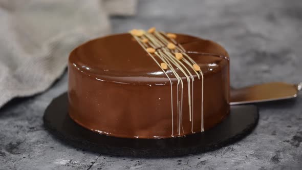 Delicious Chocolate Caramel Peanut Mousse Cake with Mirror Glaze