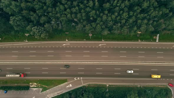 Traffic of Cars and Trucks on the Threeway Country Road in Summer Day  Overhead Shot alt